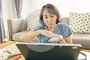 Asian woman aged 30-35 years using tablet, watching lesson Sign language online course communicate by conference video call from