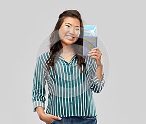 asian woman with air ticket and immunity passport