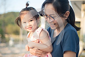 Asian woman and Asian child happiness together.