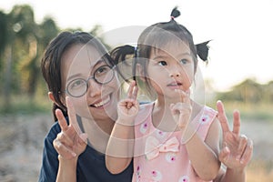 Asian woman and Asian child happiness together.