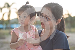 Asian woman and Asian child happiness together.