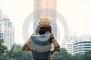 Asian woman backpacking starting traveling in city background