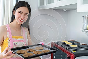 Asian woman Bake a cookies woman by oven