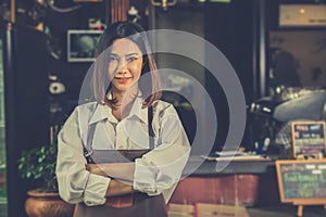 Asian woman barista successful small business owner standing in photo