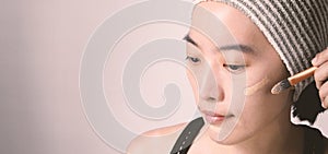 Asian woman beautiful face make up by foundation liquid