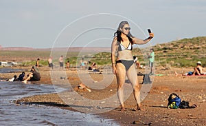 Asian woman bikini selfie picture at beach