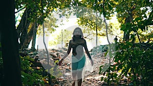 An Asian woman with blonde hair exploring the tropical island with an amaze expression lonely