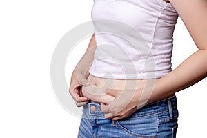 Asian woman body fat belly side view and hand squeezing excess fat isolate on white background , clipping path include photo