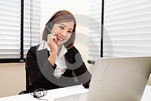 Asian woman call center with headphone in headsets concept