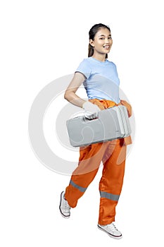 Asian woman car technician in uniform carrying car jack box and wrench