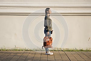 Asian woman carrying a bag