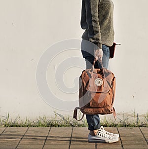 Asian woman carrying a bag