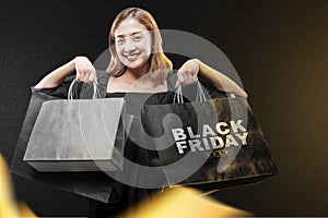 Asian woman carrying a shopping bag