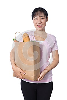 Asian Woman carrying shopping bag with groceries