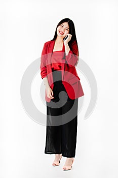 Asian woman in casual dress holding smartphone selfie