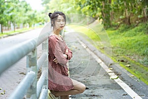 Asian woman in casual dress with thinking face and stress hand cross arm no smile with copy space