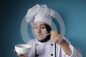 Asian Woman Chef Making Soup, Chef Tasting Soup From White Bowl