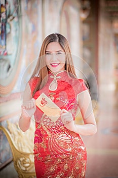 The Asian woman in chinese dress holding couplet 'Lucrative' (C