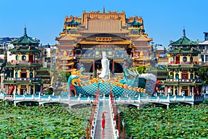 Asian woman in chinese dress traditional walking at temple in Kaohsiung, Taiwan.