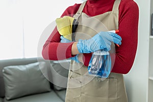 Asian woman cleaning staff, company office cleaning maid, maintaining cleanliness in the office. Cleaning concept and housekeeper