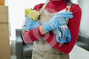 Asian woman cleaning staff, company office cleaning maid, maintaining cleanliness in the office. Cleaning concept and housekeeper