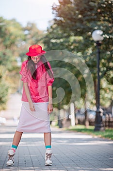 Asian woman in colourful fashion trendy clothes