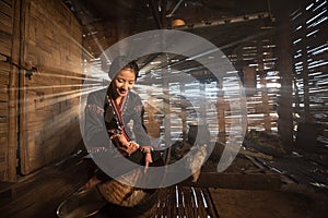 Asian woman cooking at house in rural