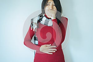 Asian woman coughing with sore throat,Female suffering with cough a lot in bedroom,Copy space and white background photo