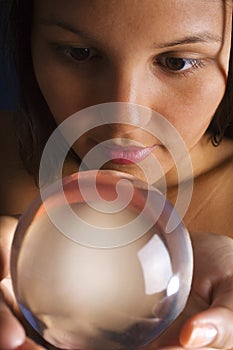 Asian woman with crystal ball