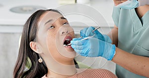 Asian woman, dentist and patient with cleaning tools for mouth, oral or gum in dental care at clinic. Face of female