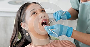 Asian woman, dentist and patient with clinic tools for cleaning mouth, oral or gum in dental care. Face of female person