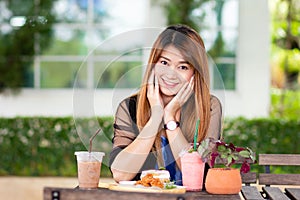 Asian woman with desserts