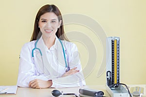 Asian woman doctor with smiling face sit in office at hospital