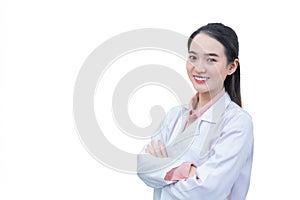 Asian woman doctor who she has black long hair, wear white lab coat as uniform while arm cross at office room in hospital in