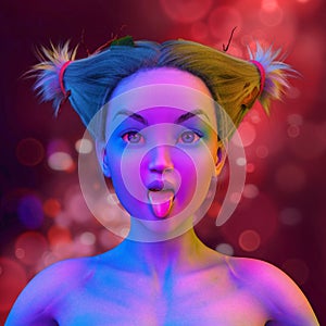 Asian woman doing a lick face in colorful bright neon lights posing in studio