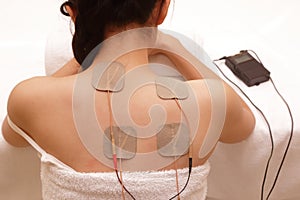 Asian woman is doing massage of electrical -stimulation