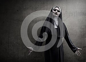 Asian woman dressed in evil nun