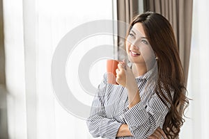 Asian Woman drinking coffee