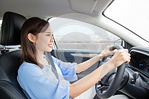 Asian woman driving car