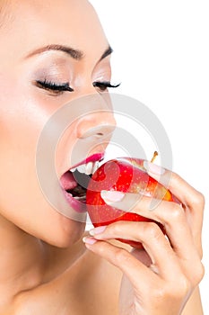 Asian woman eating apple