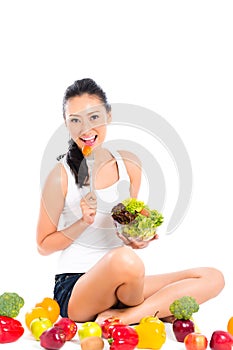Asian woman eating healthy salad