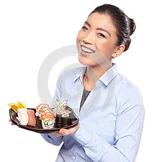 Asian woman eating sushi. Shallow depth of field, focu