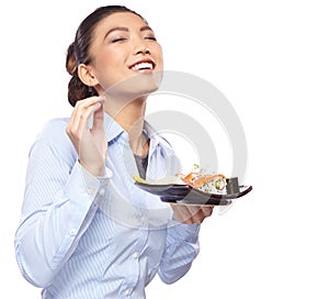 Asian woman eating sushi. Shallow depth of field, focu