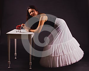 Asian woman in elegant white skirt holds strawberries. Fresh food, fruit. Brown toned image