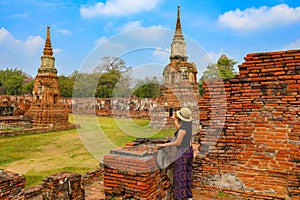 woman enjoy her visit temple at Ayutthaya ancien city in Thailand photo