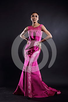 Asian woman in evening long ball dress