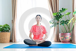 Asian woman exercise in her living room