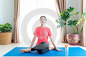 Asian woman exercise in her living room