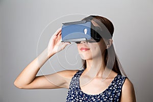 Asian woman experience though VR device photo