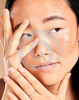 Asian woman, face and hands thinking for beauty wellness, skincare dermatology cosmetics skin glow in studio. Model